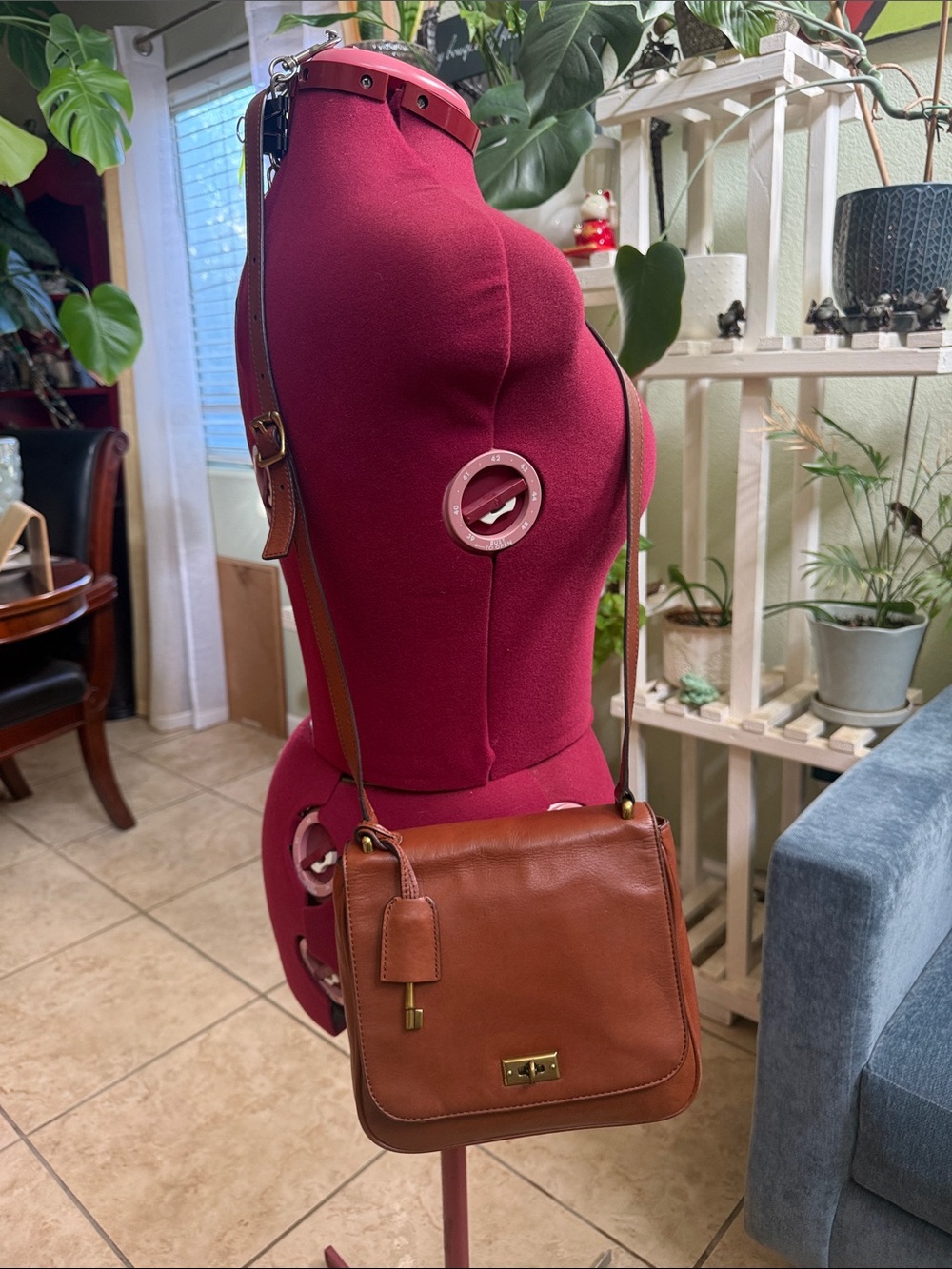 Fossil Memoir Novella flap crossbody bag with a brass key charm and turn-lock cl
